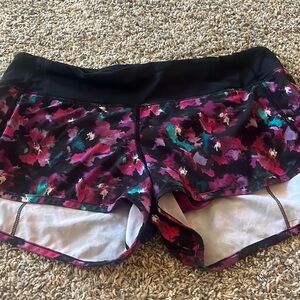 Lululemon speed up shorts. Purple and pink floral print.